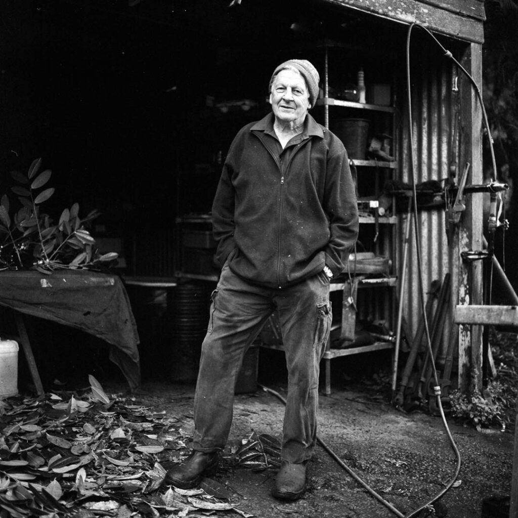black and white portrait on film of a man in his shed - the search for Gold in Olinda