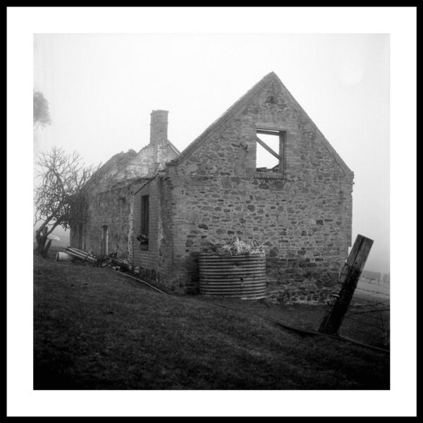 darkroom printing - black and white photograph of a stone building in ruins